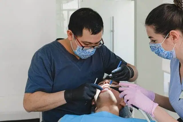 male dentist with patient